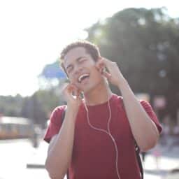 Man listening to music through headphones.